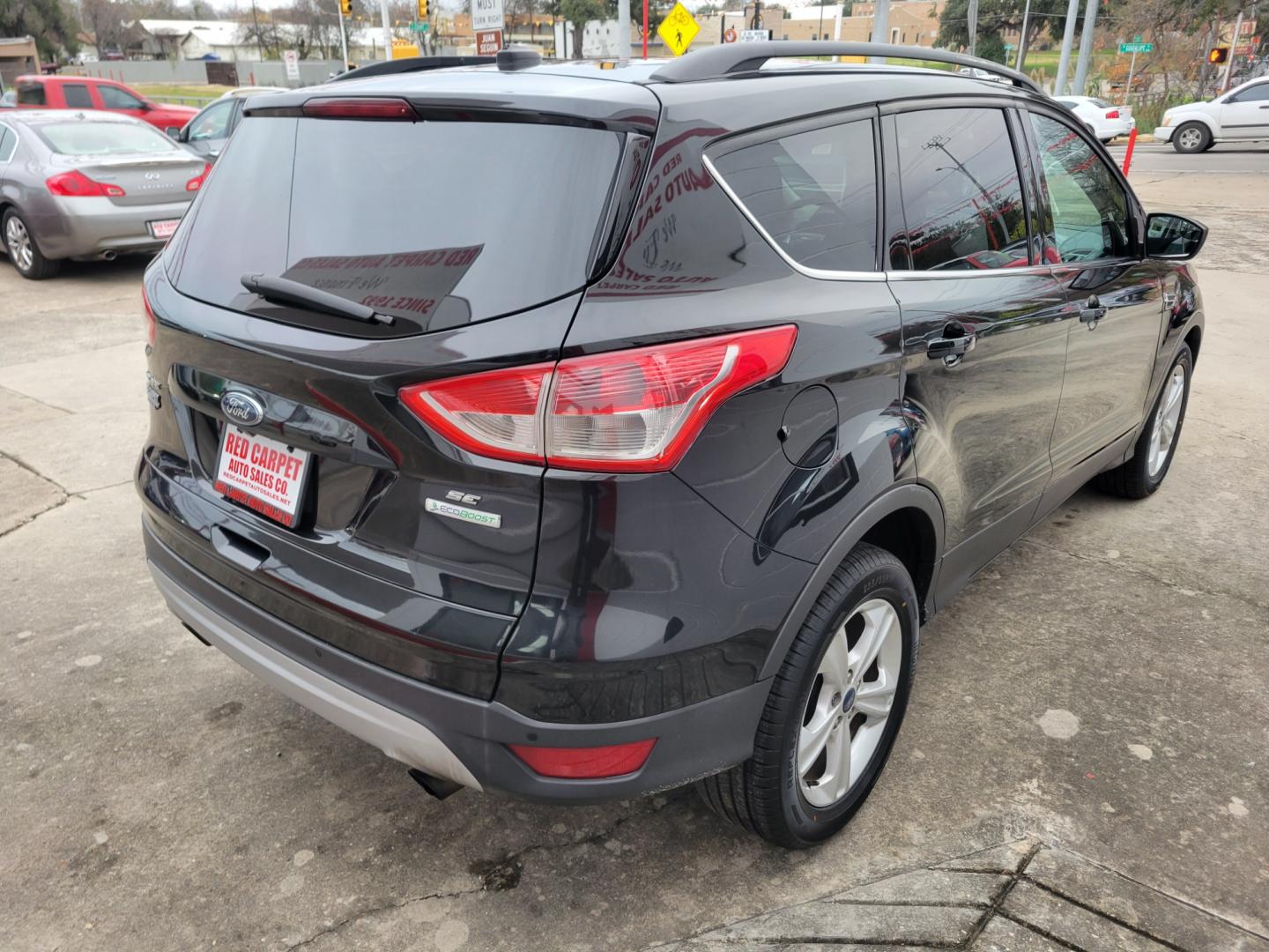 2014 BLACK Ford Escape SE FWD (1FMCU0G97EU) with an 2.0L L4 DOHC 16V engine, 6-Speed Automatic transmission, located at 503 West Court, Seguin, TX, 78155, (830) 379-3373, 29.568621, -97.969803 - Photo#2